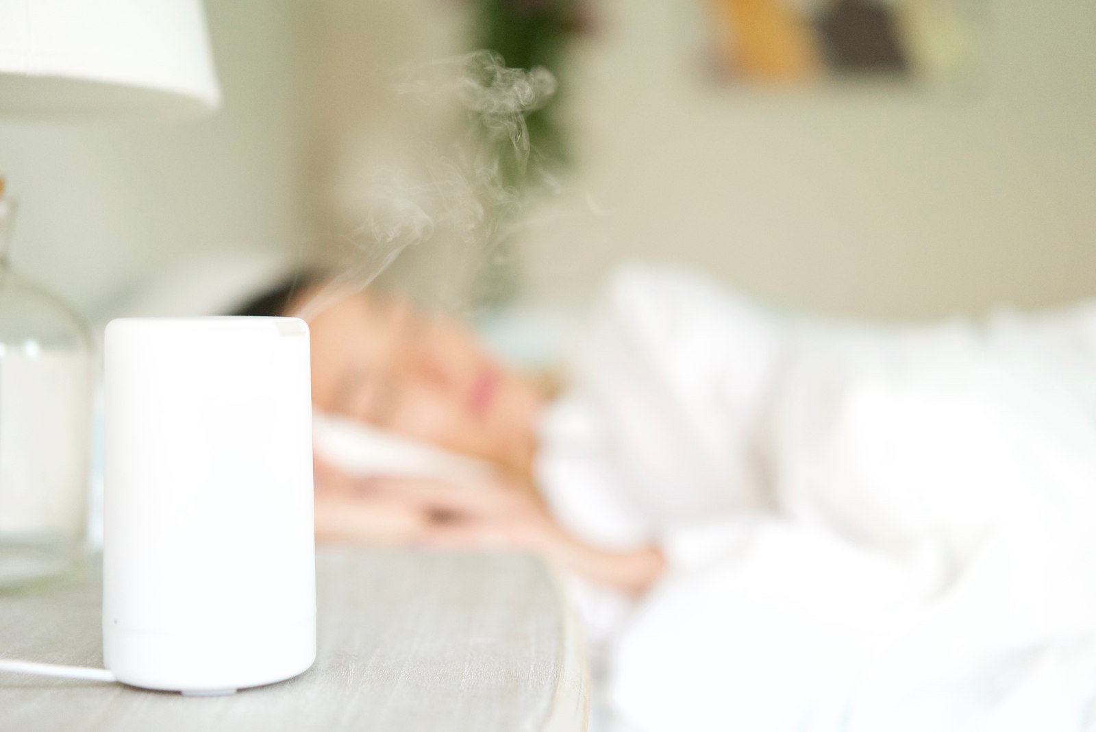 Mantra diffuser with steam, spa scene in the background
