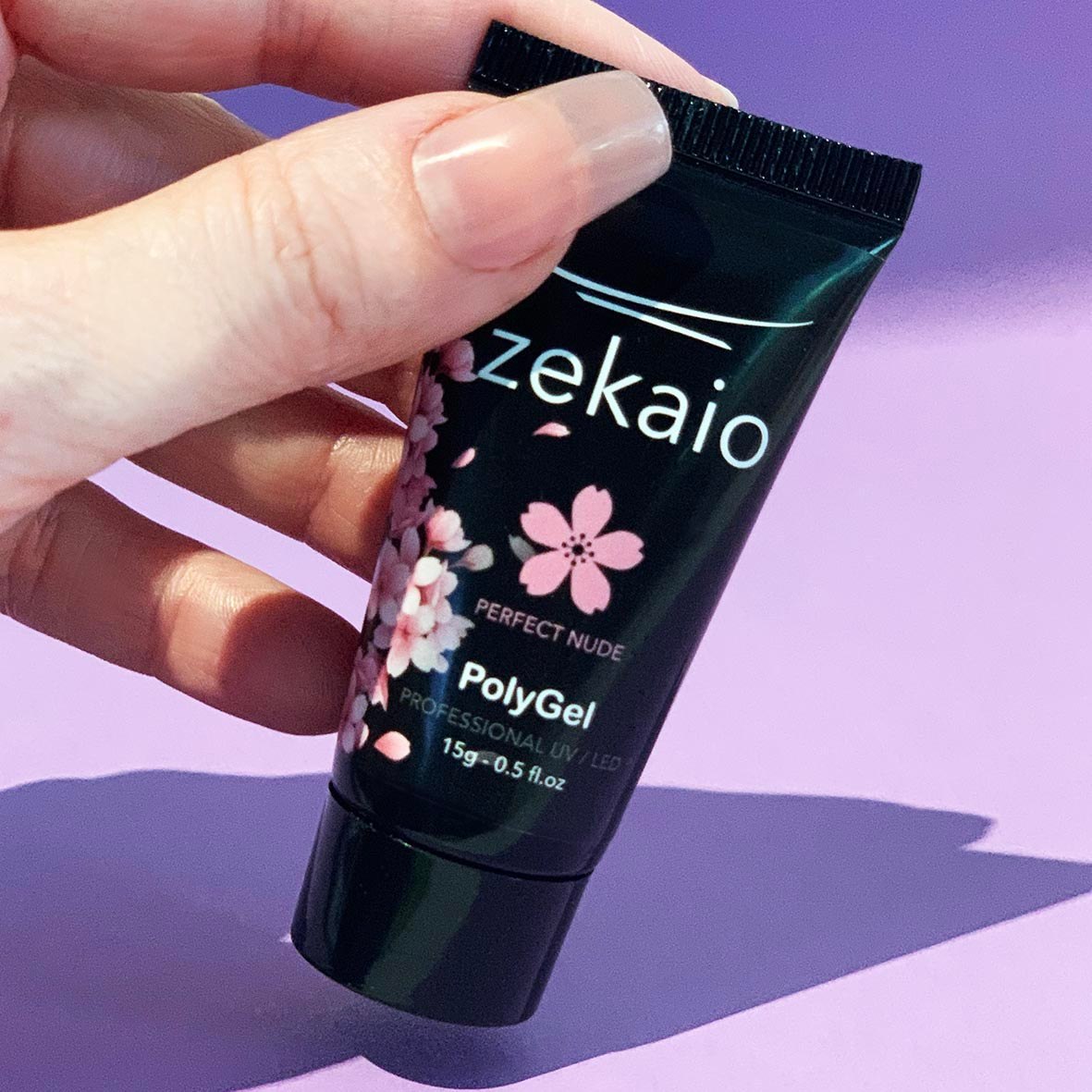 Hand holding a Zekaio Perfect Nude PolyGel tube