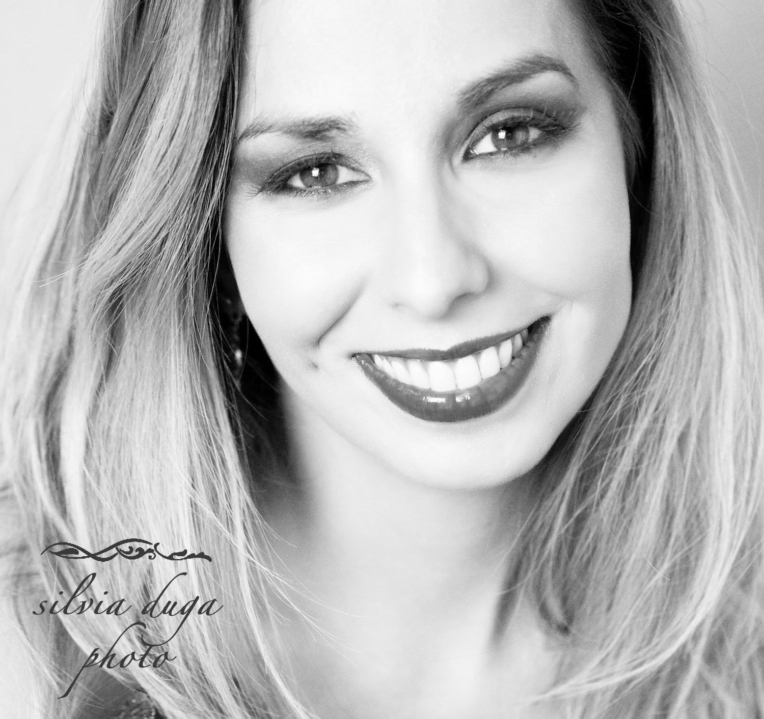 Black and white close-up portrait, smiling